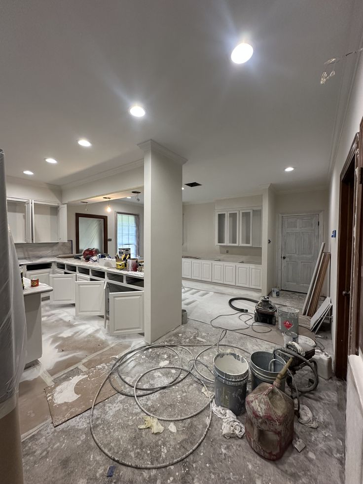 Pinecrest kitchen with a single-slab stone island, white oak cabinetry, and brass fixtures